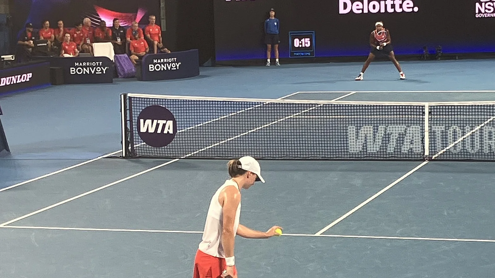 Iga Swiatek at the United Cup semi-finals starting her serve motion.